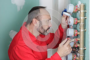 Man takes readings water meters