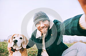 Man takes selfie photo with his best freind beagle dog