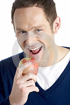 Man Taking Bite Of Apple