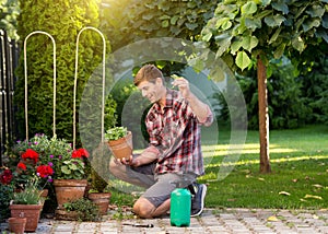 Man taking care of plants in garden