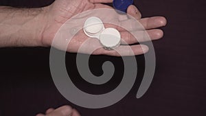 Man taking contact lens from storage case, visual impairment. Close-up of hands.