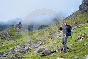 Man taking images of the beautiful scottish landscape