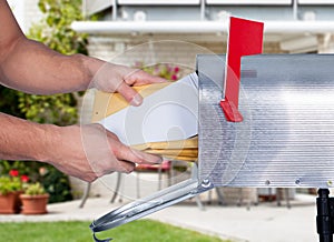 Man Taking The Letters From Mailbox