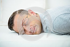 Man taking little nap on sofa