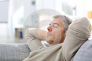 Man taking a nap in sofa photo