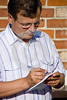 Man taking notes