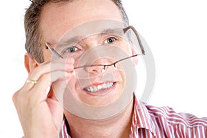 Man taking off glasses