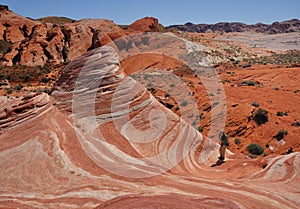 Man Taking a Photo of the Fire Wave Sandstone Formation