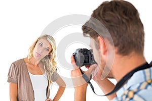 Man taking photo of his girlfriend sticking her tongue out