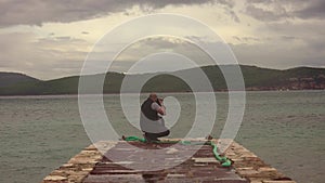 Man taking a photos with dslr camera outdoors, on the beach