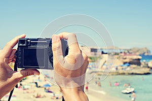 Man taking a picture at Cala Conta beach in San Antonio, Ibiza I