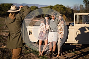 Man taking a picture of his friends during safari vacation