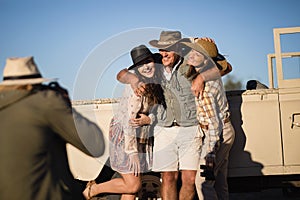 Man taking a picture of his friends during safari vacation