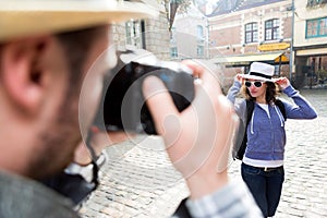 Man taking picture of his girlfriend on hoildays