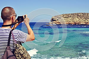 Man taking a picture in Ibiza Island, Spain