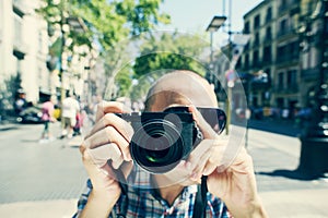 Man taking a picture of the observer at La Rambla in Barcelona,