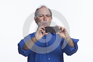 Man taking picture with smartphone, horizontal