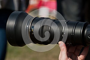 Man taking a picture with a zoom lens