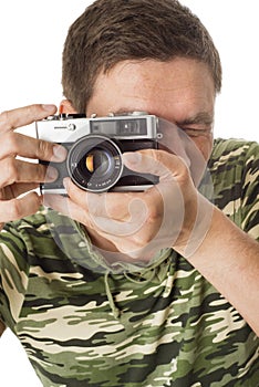 Man taking pictures with retro camera