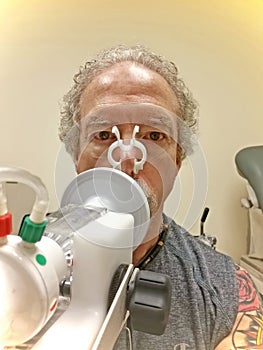 Man Taking Pulmonary Function Test