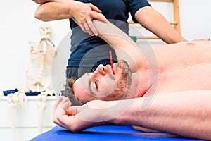 Man taking pulmonary function test with mouthpiece in his hand