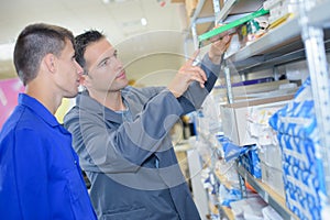 Man taking ream paper from shelf