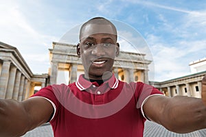 Man Taking Selfie At Brandenburg Gate