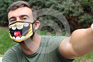 Man taking a selfie with fun PPE