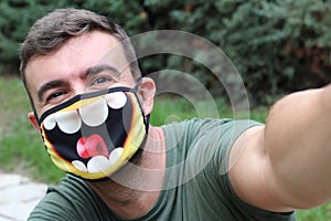 Man taking a selfie with fun PPE