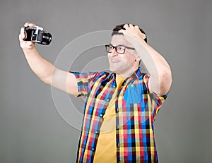 Man taking selfie isolated on gray background