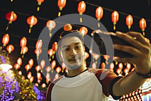 Man taking selfie at lantern festival