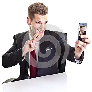 Man taking selfie photo on mobile phone