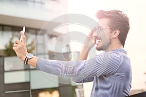 Man taking a selfie with a smartphone