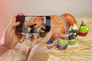 Man taking shot of Halloween decoration