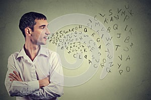 Man talking with alphabet letters coming out of his mouth. Communication, information, intelligence concept