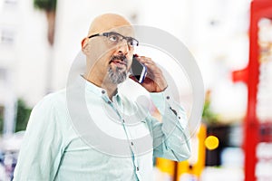 Man talking mobile phone outdoors