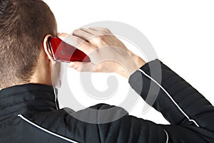 Man is talking on red smart phone | Isolated