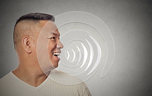 Man talking with sound waves coming out of his open mouth