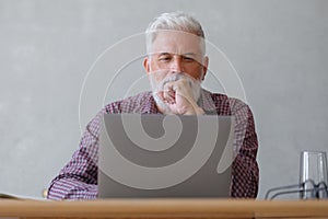 man talks on the phone with colleagues or business partners, solving financial and legal problems