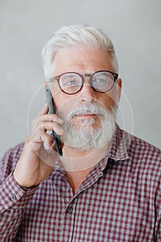 man talks on the phone with colleagues or business partners, solving financial and legal problems