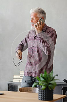 man talks on the phone with colleagues or business partners, solving financial and legal problems