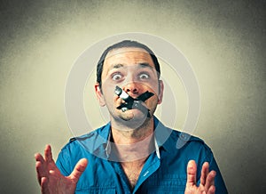 Man with the taped mouth photo