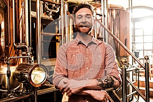 Man tasting fresh beer in a brewery