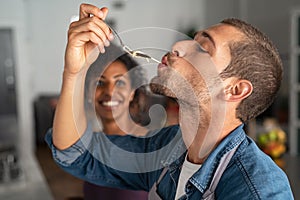 Man tasting spaghetti