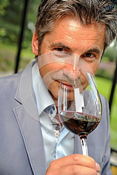 Man tasting wine in a castel-Winemaker