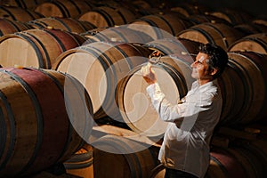 Man tasting wine in a cellar-Winemaker