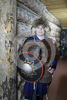 Man in tatar leather armor with shield