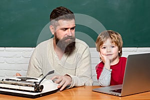 Man teacher play with preschooler child. Man teaches child. father teaching her son in classroom at school. School