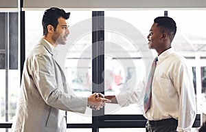 Man teacher  stand and shakehand with black students after succeed. Diversity of two people