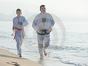 man and teenagerl in a kimono run